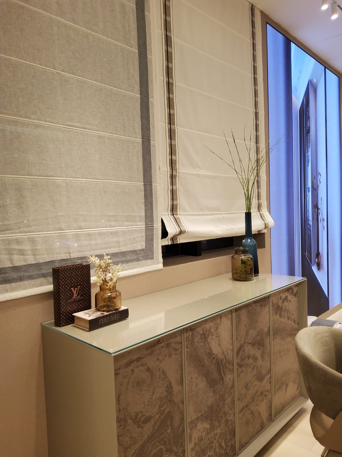 Pink flowers bloom on a hillside.