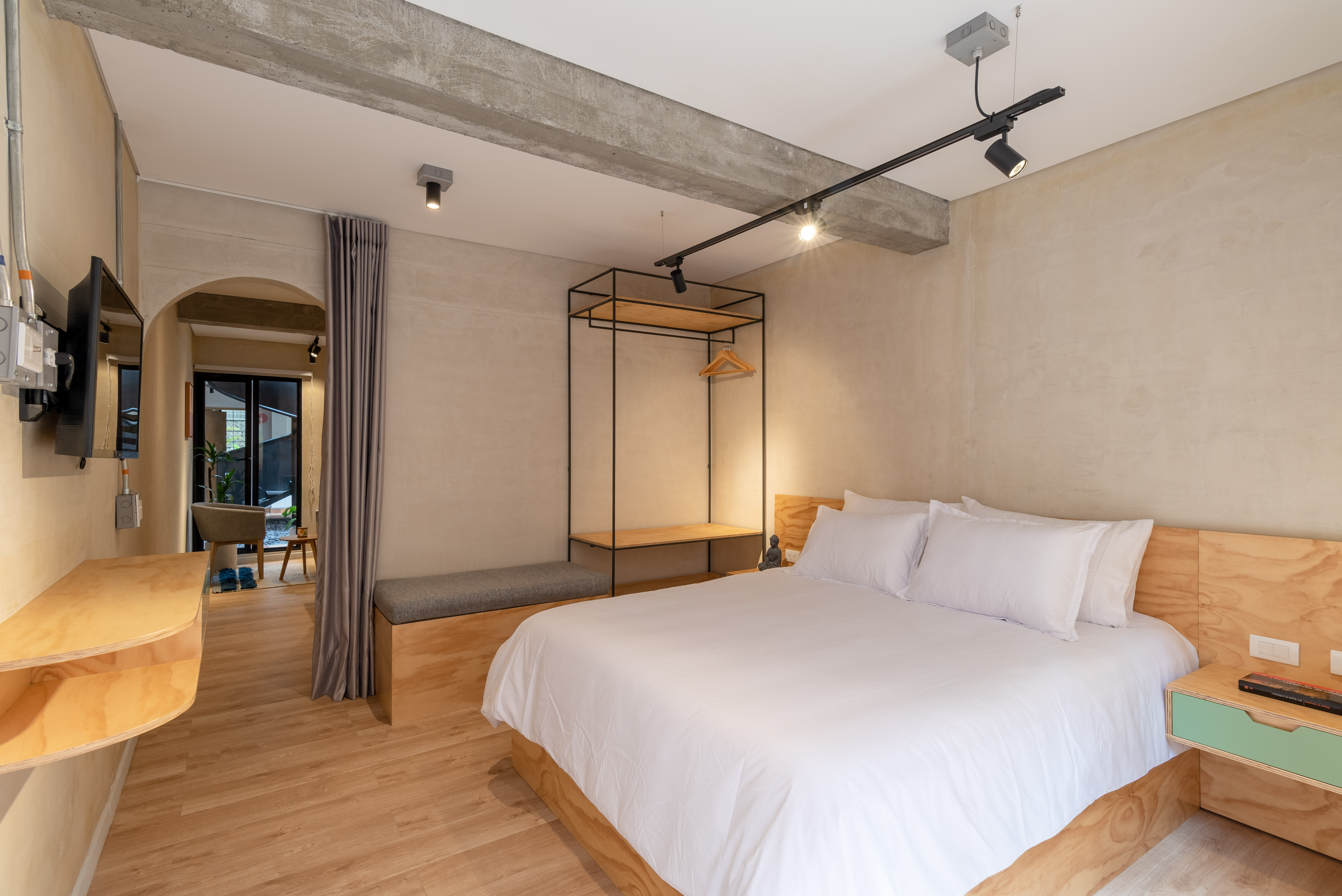 Double-height interior with flowing sculptural forms and warm raking light
