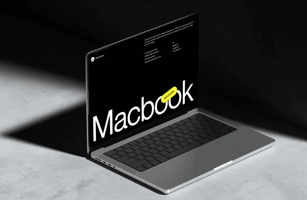 A sleek MacBook mockup placed on a concrete surface under soft directional lighting, showcasing its slim aluminum design and open screen with a customizable black display.