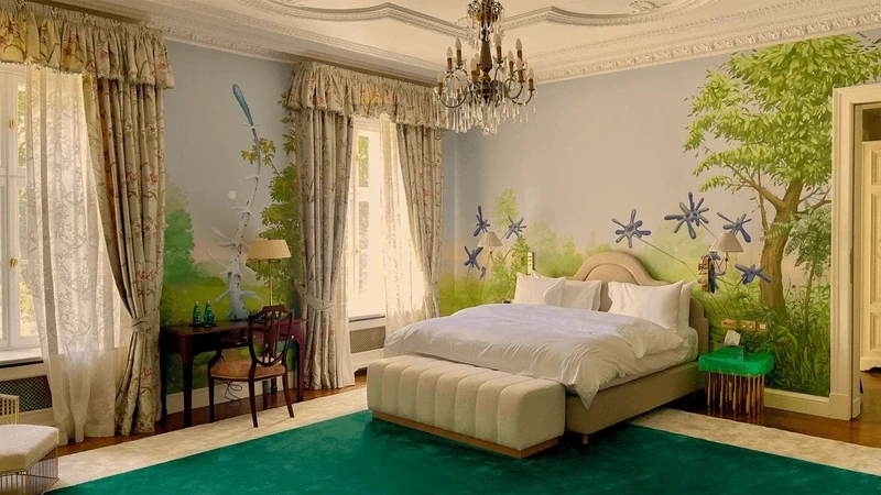 a palace bedroom with a large continental bed