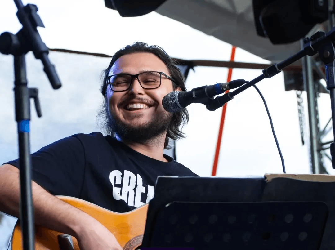 man standing near balcony