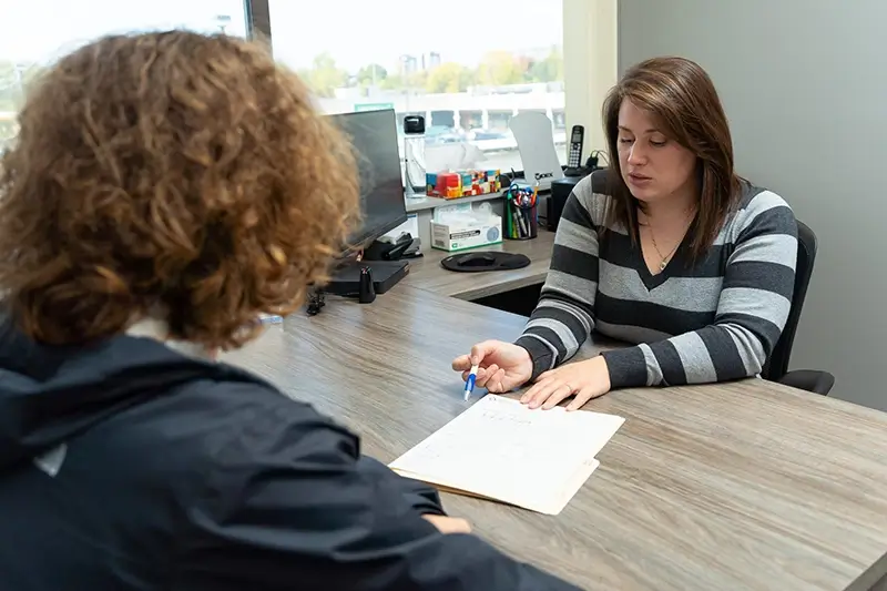 A team member explaining a CAP assessment to a patient