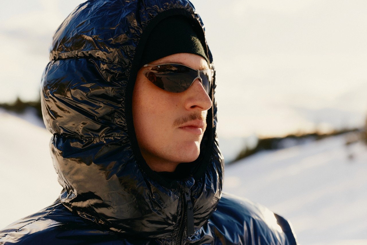 Guy wearing black glasses and black winter jacket 