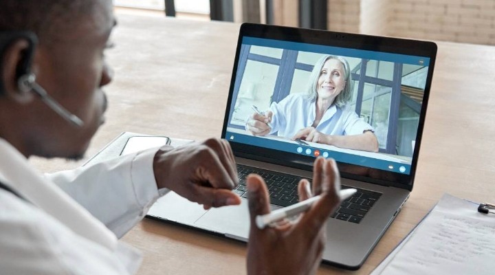 healthcare provider during telehealth consultation with a checklist