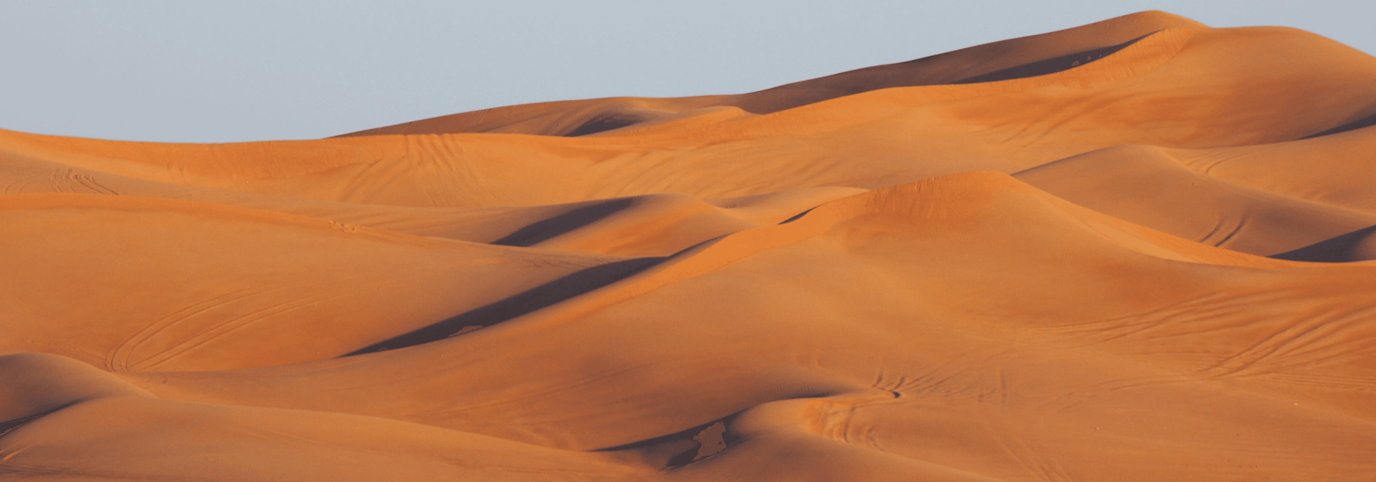 A pink hand reaching out of pink liquid