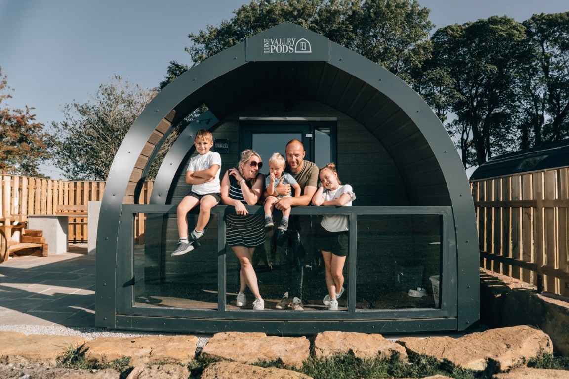 A photo of the Smith family at Eastfield Glamping Farm.
