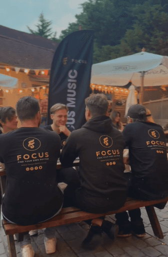 The Focus Music team discussing and having fun at the local venue