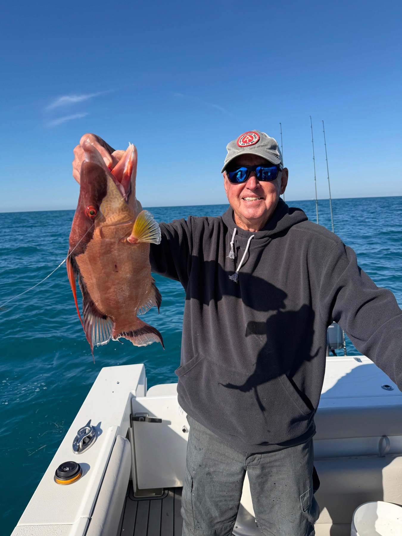 Angler with a catch aboard the Nautical Native fishing charter boat in Bradenton