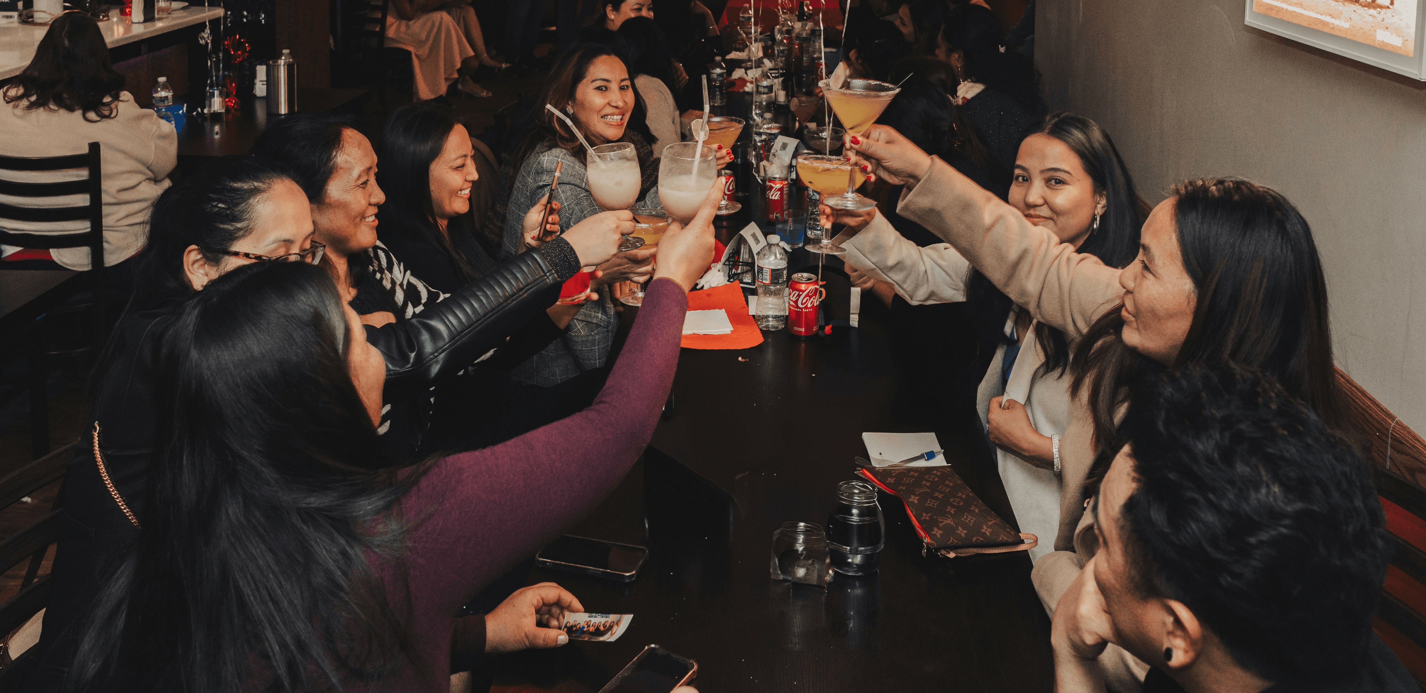 A group of people sitting around a table