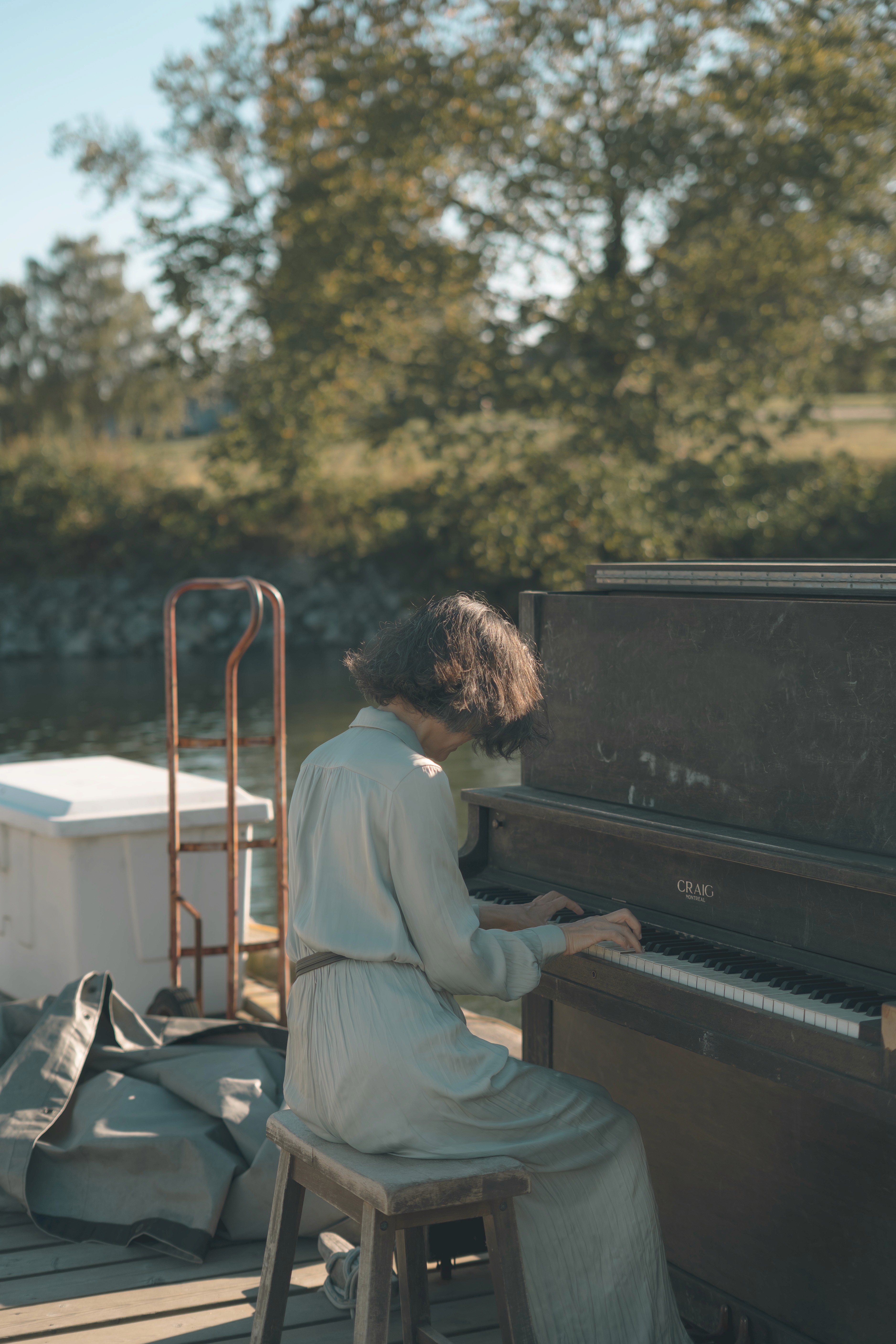 Vintage travel posters displayed at an outdoor market.