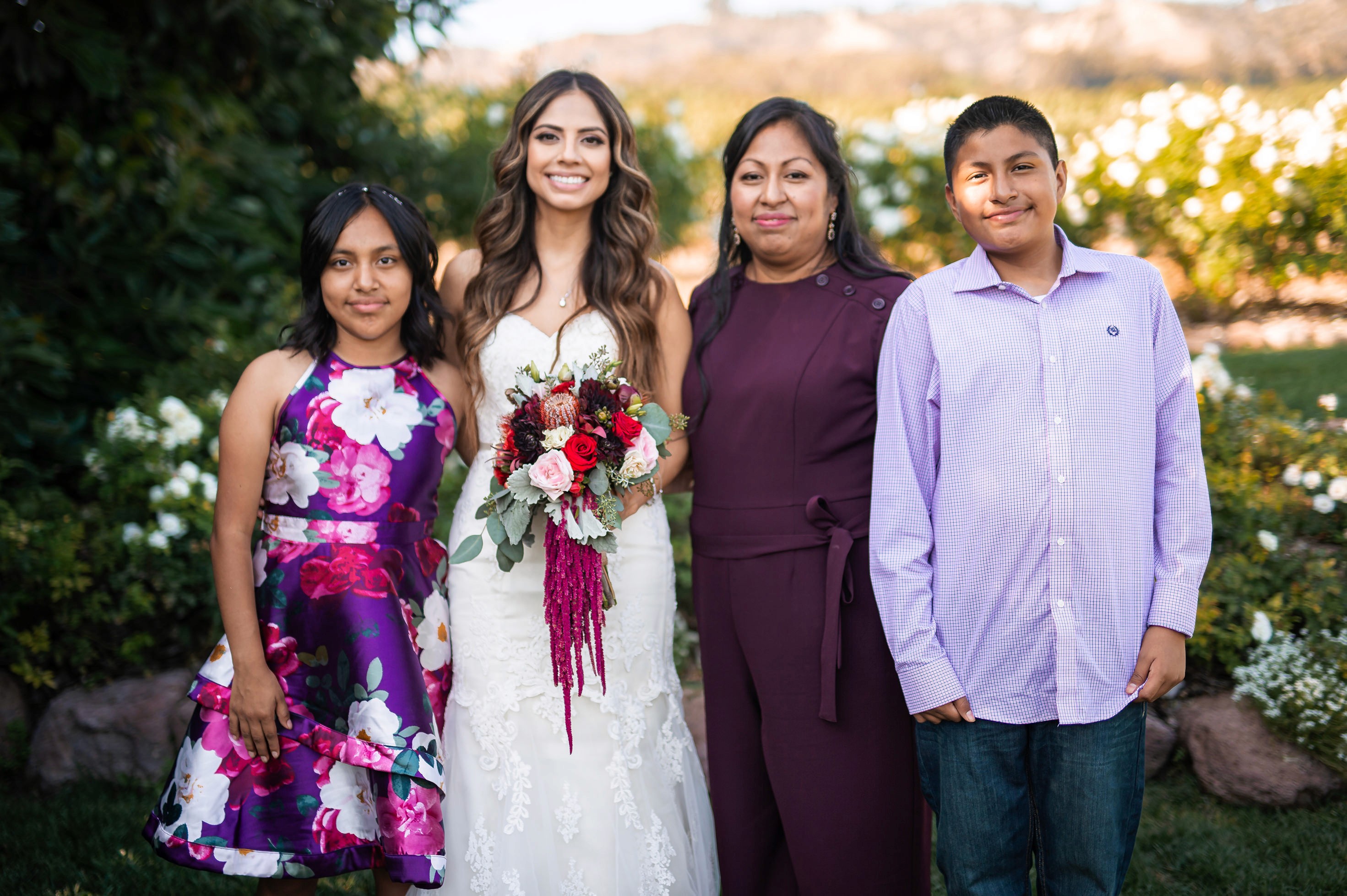 Flat lay wedding details with bouquet, rings, and sparkling bridal heels