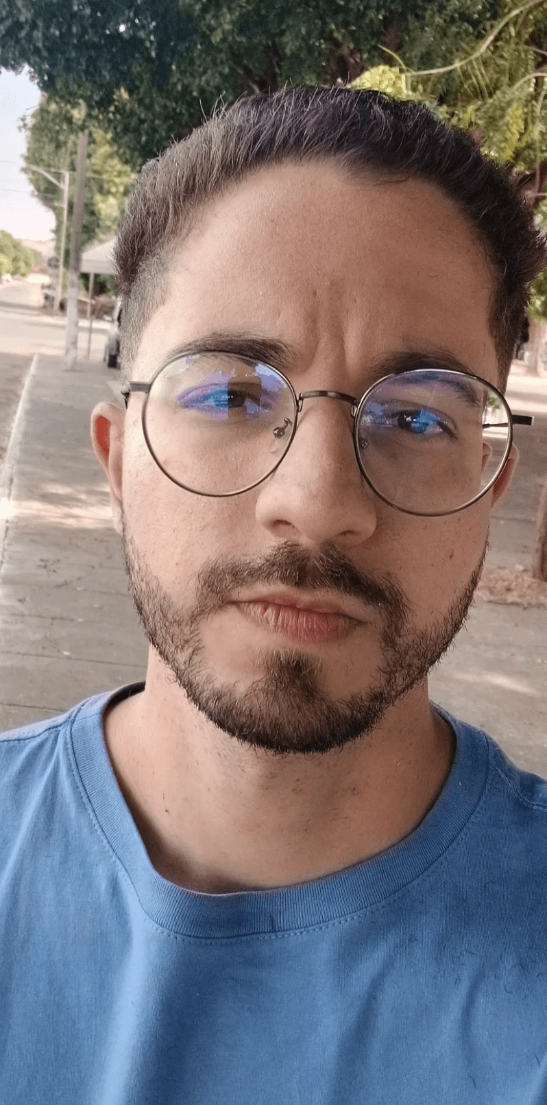 A photo of a man wearing a cap looking above