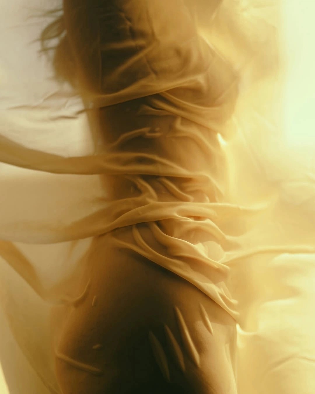 Woman in black dress with orange light effect