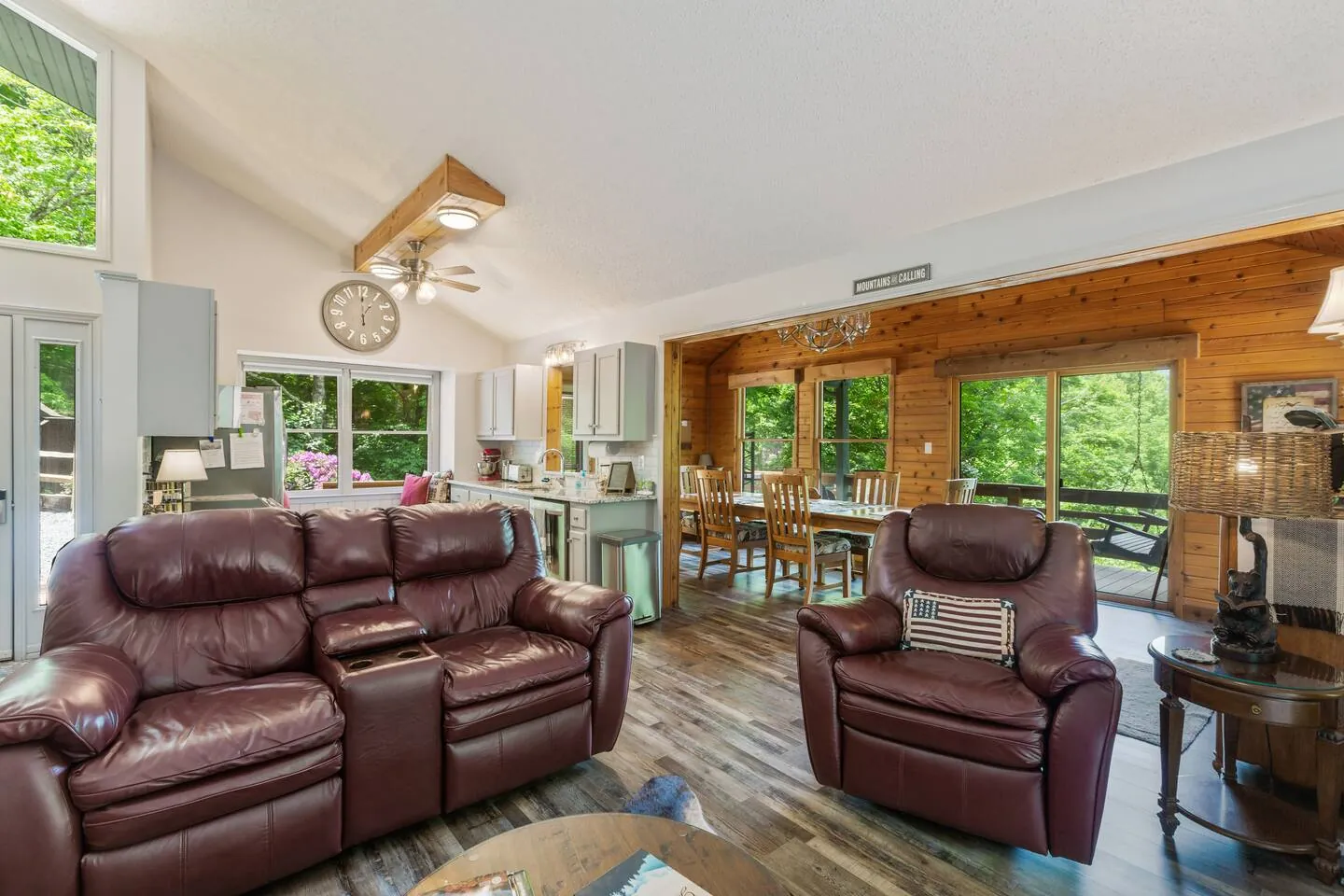 Bella Vita open great room with leather sofas and a vaulted ceiling