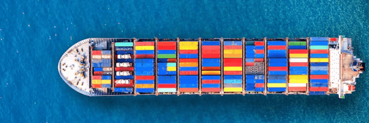 Container ship carrying colorful cargo containers at sea