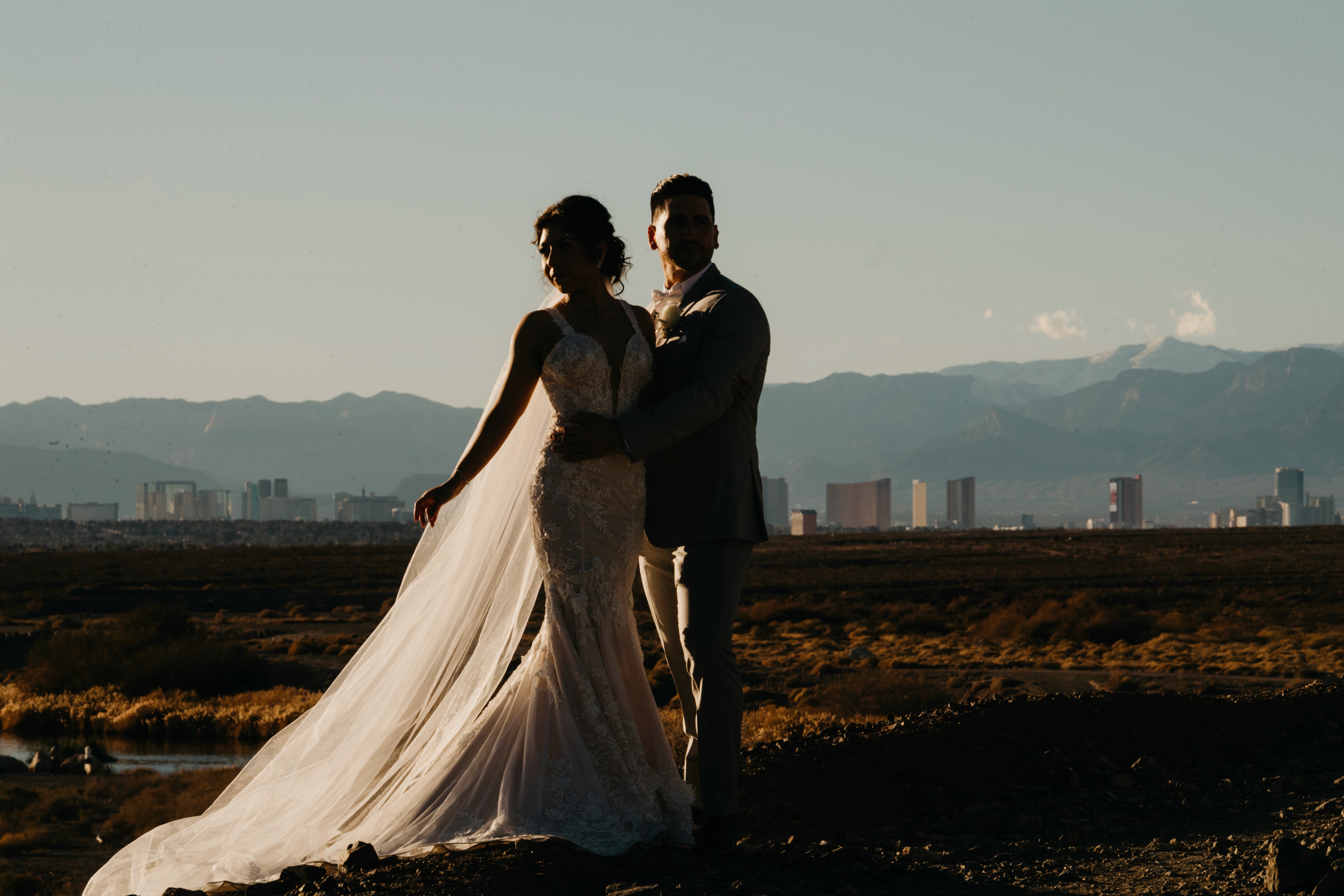 Romantic Las Vegas destination wedding portraits with city skyline