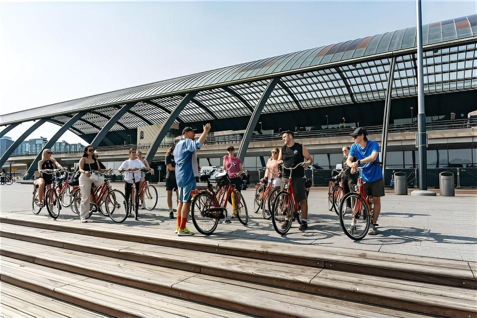 Setting off by bike from behind Amsterdam Centraal