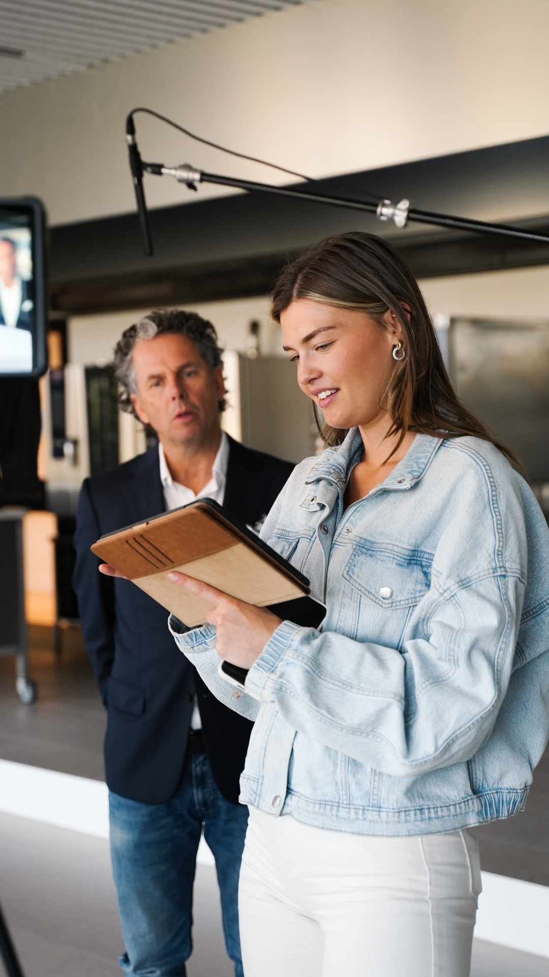 Empty room with wooden floor and large window.