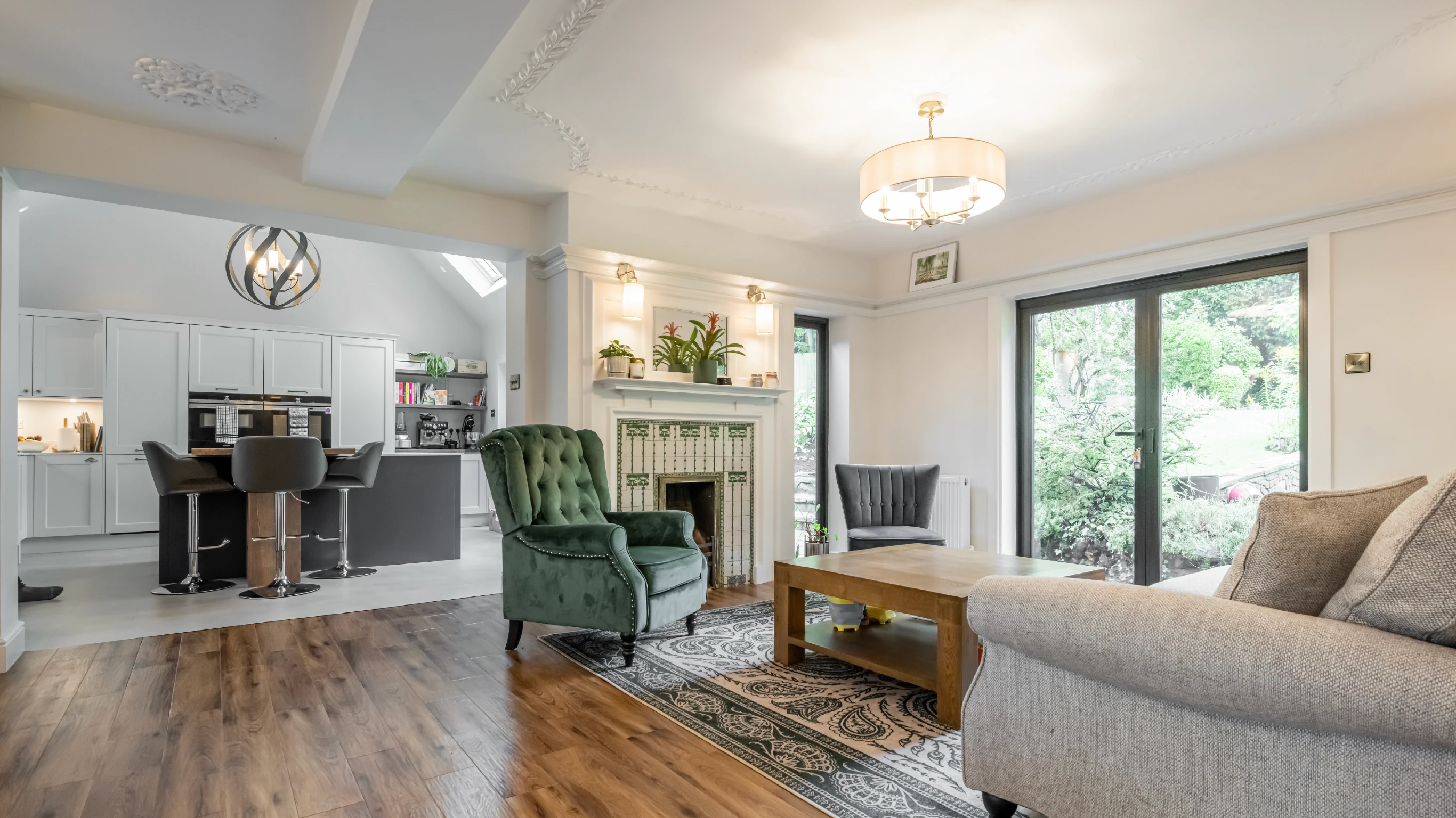 Laburnham interior shot of cozy lounge looking through to kitchen