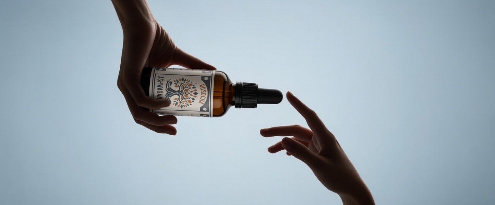 Hand holding a sleek black smartphone or mobile device against a light background