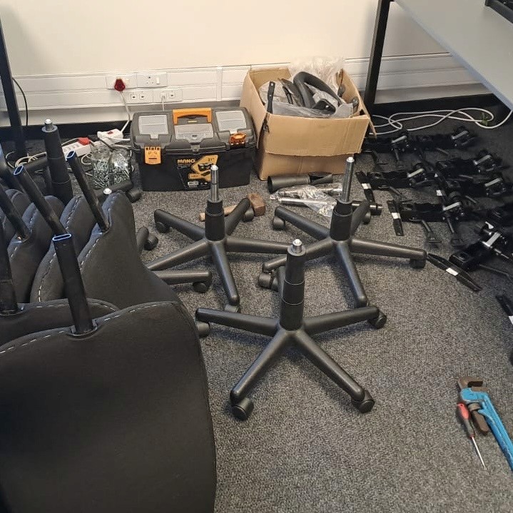 Chair repair tools and components packed in order on the floor