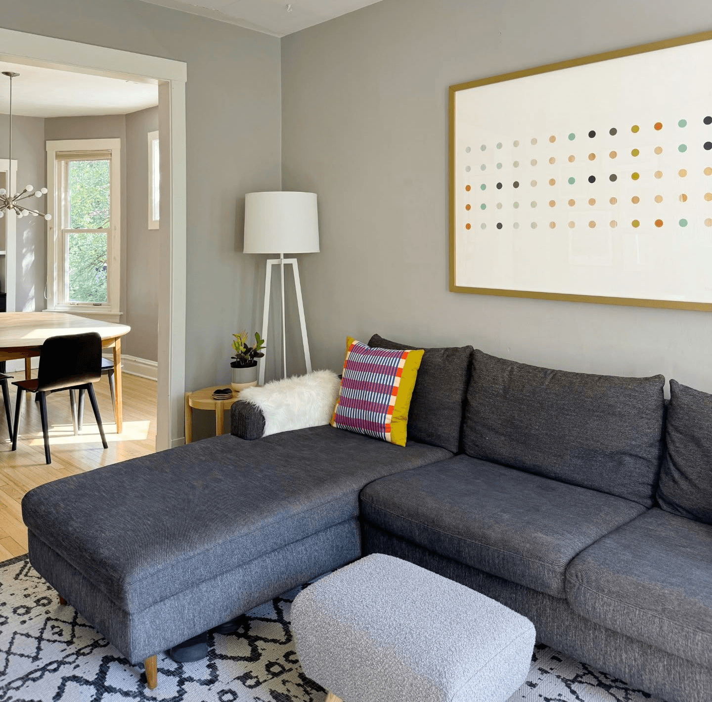 gray couch sesctional with lamp and ottoman