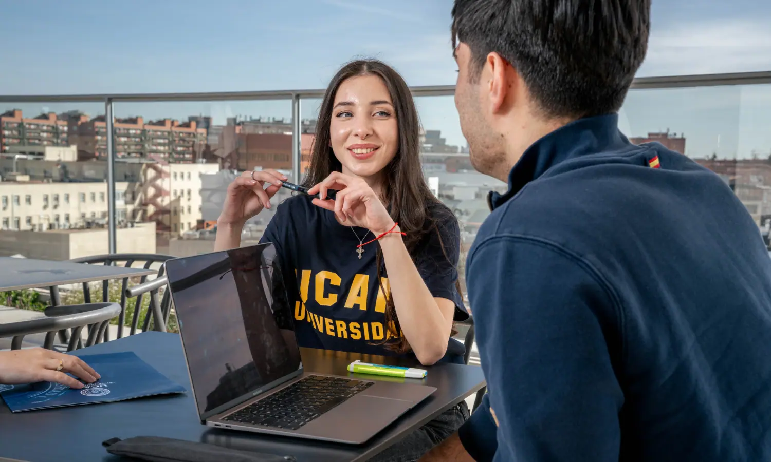 man in academic dress wearing mortar cap