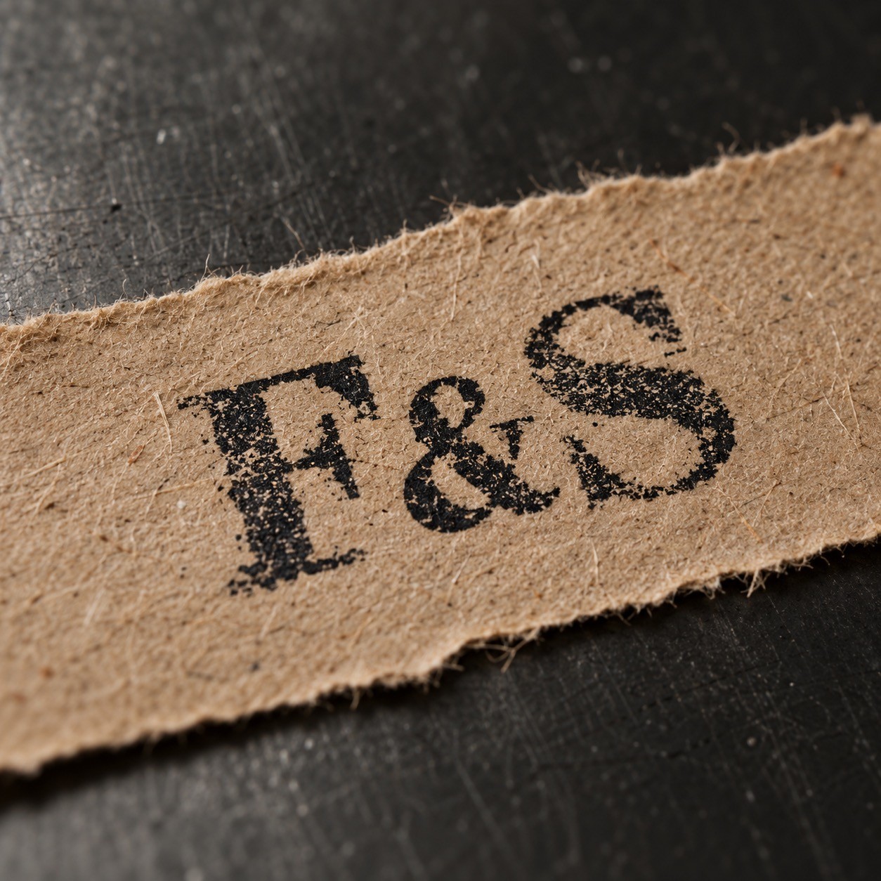 Macro of an F&S rubber-stamp impression on kraft paper