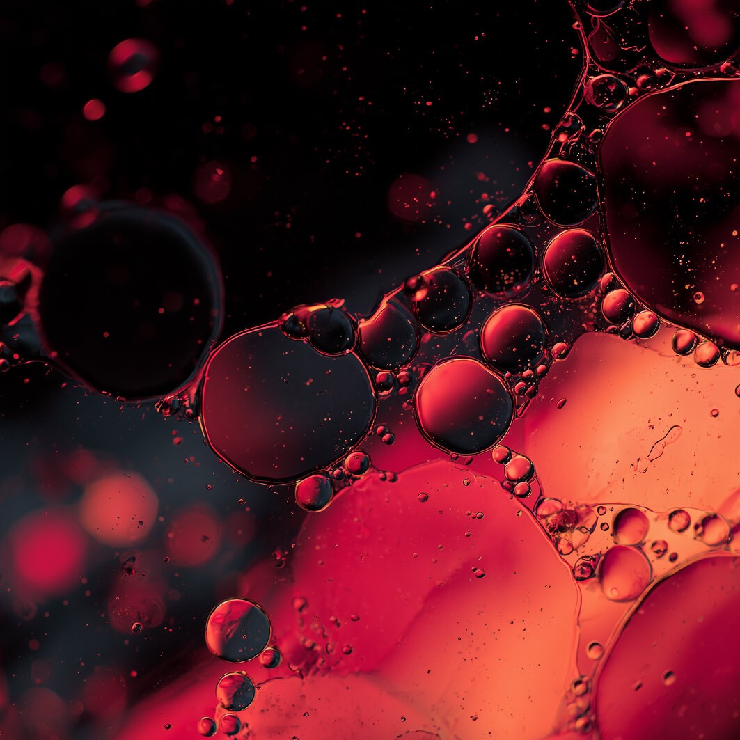 Abstract macro photography of red liquid bubbles representing advanced blood lab testing and biomarker analysis
