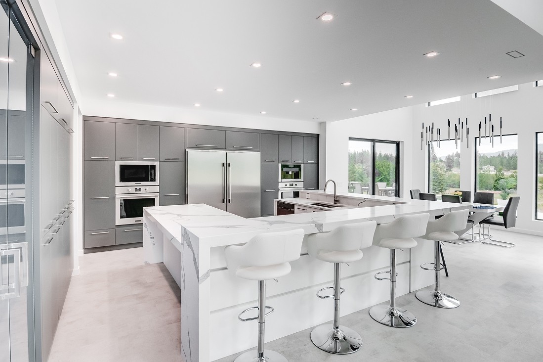Wide kitchen shot with two islands and open-concept layout