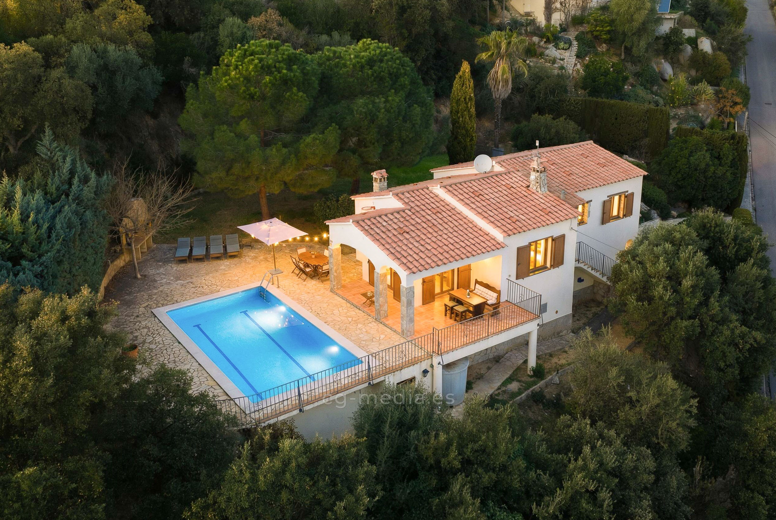 A peacefully sleeping baby wearing a knitted cream-colored hat rests on a soft, textured blanket, capturing a serene moment of newborn tranquility.