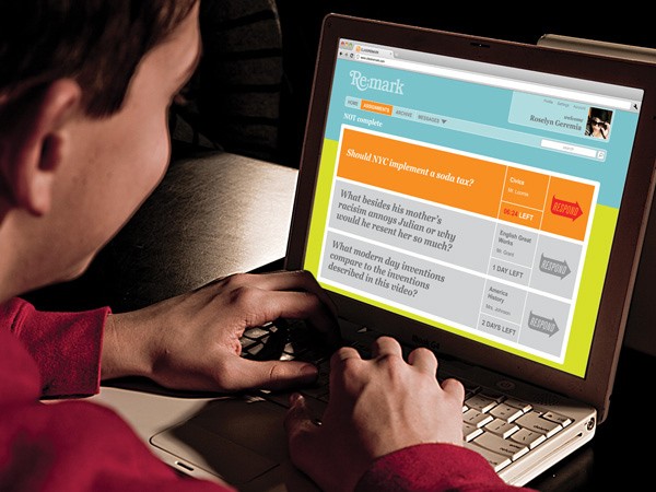 A person with short brown hair, wearing a red long-sleeved shirt, is typing on a silver laptop keyboard. The laptop screen displays a webpage titled “Remark” with a light blue header and an orange section containing text. The visible text includes “Should NYC implement a soda tax?”, “What besides his mother’s racism annoys Julian or why would he resent her so much?”, “What modern day inventions compare to the inventions described in this video?”, and a name “Roselyn Geremia” in the top right corner. The laptop is resting on a dark surface.