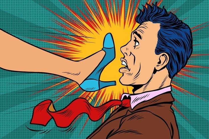 A woman smiling at the camera in a cafe