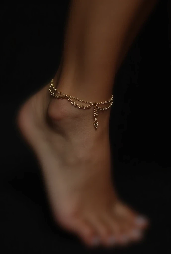 Gold anklet with charm