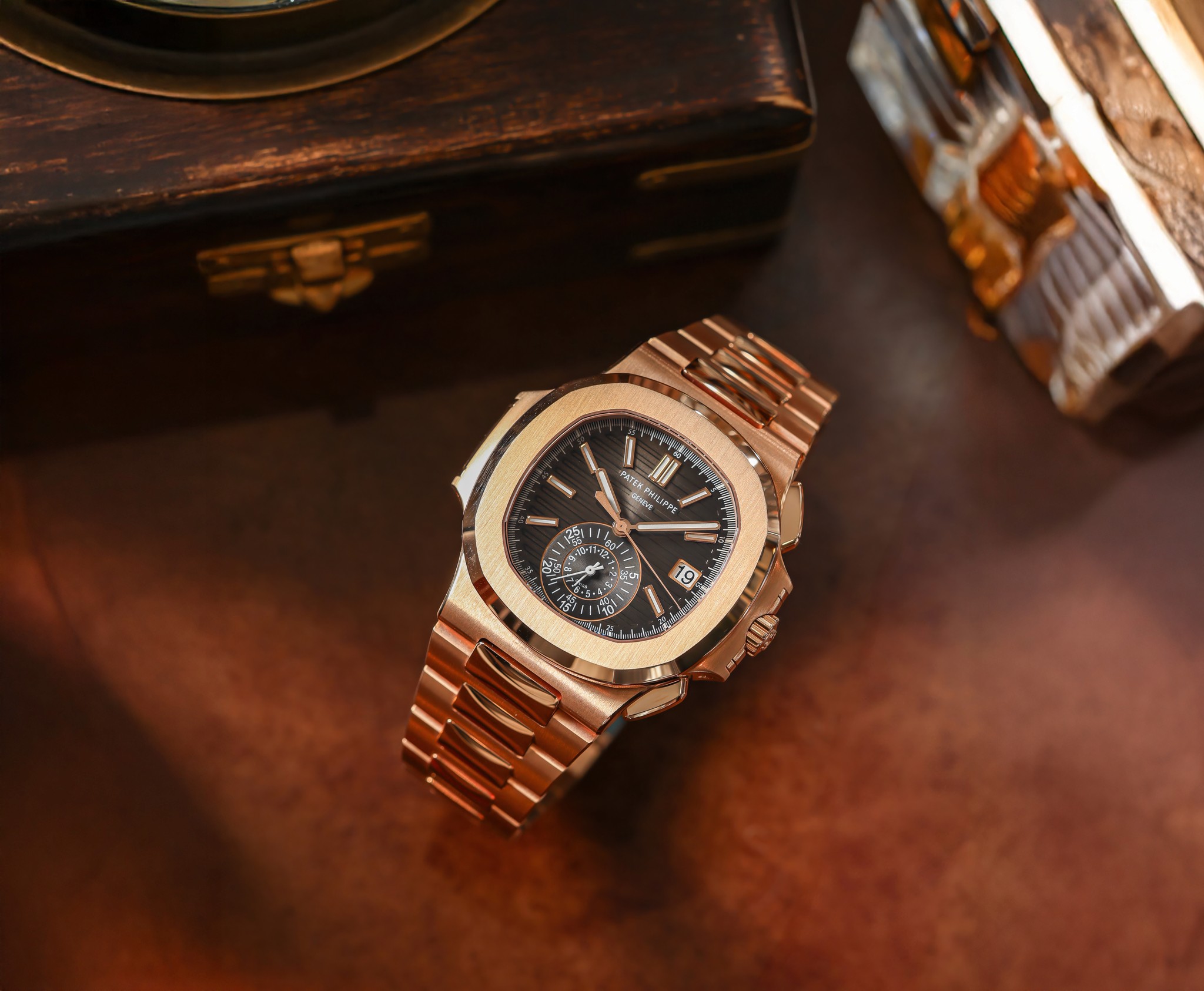 A close-up of a stylish brown band watch on a wooden surface, set against a vintage backdrop.