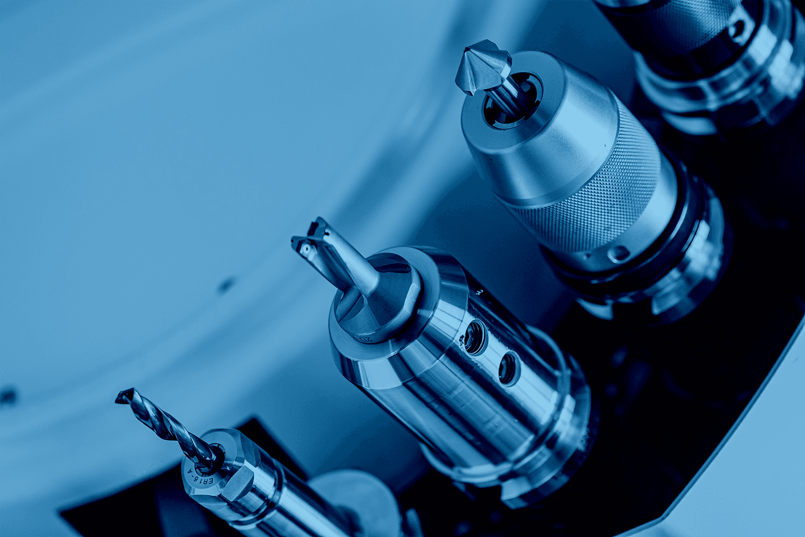 Machined metal parts and tools for direct part mark barcode identification