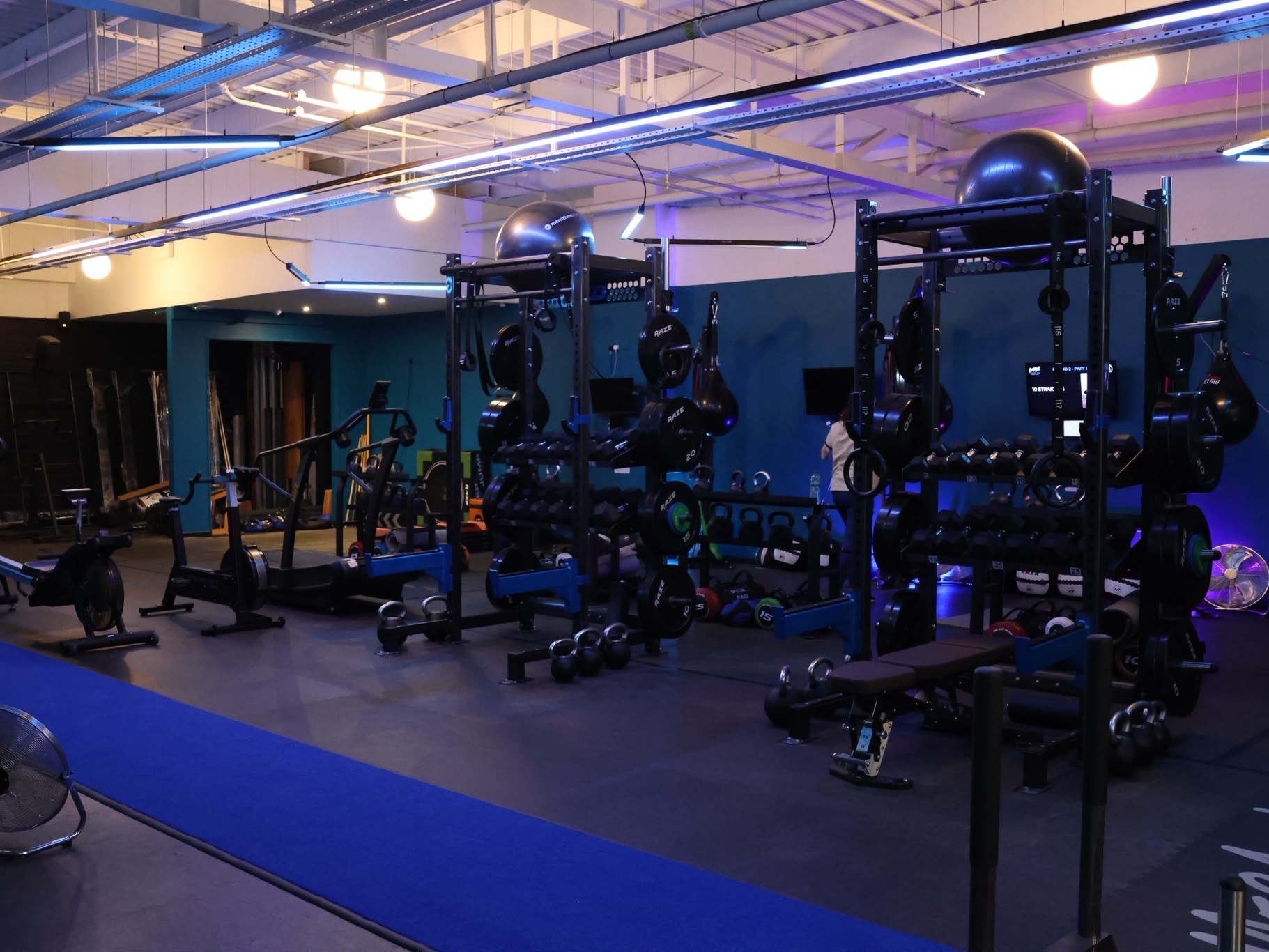 The racks, weights and cardio machines on the gym floor at MegaBox Fitness