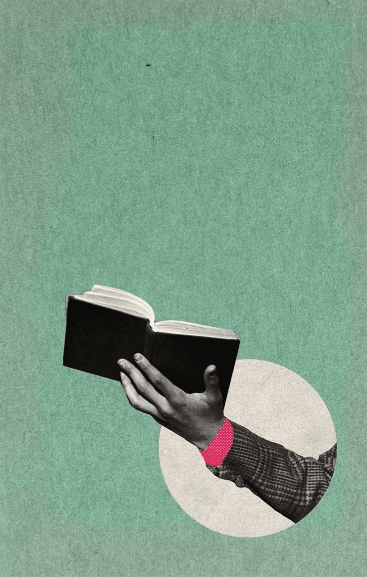 a hand holding a book