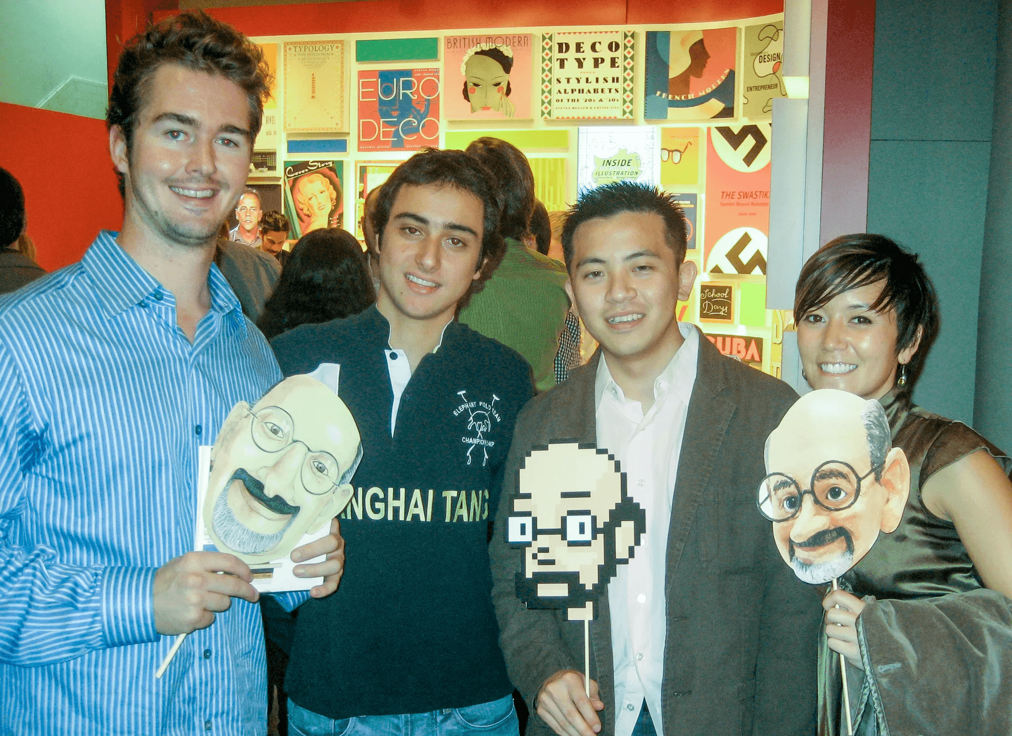 Group photo of Scott Suiter, Gustavo Garcia, Nigel Sielegar, and Kimiyo Nakatsui (class of 2009) at a book publishing event for Steve Heller.