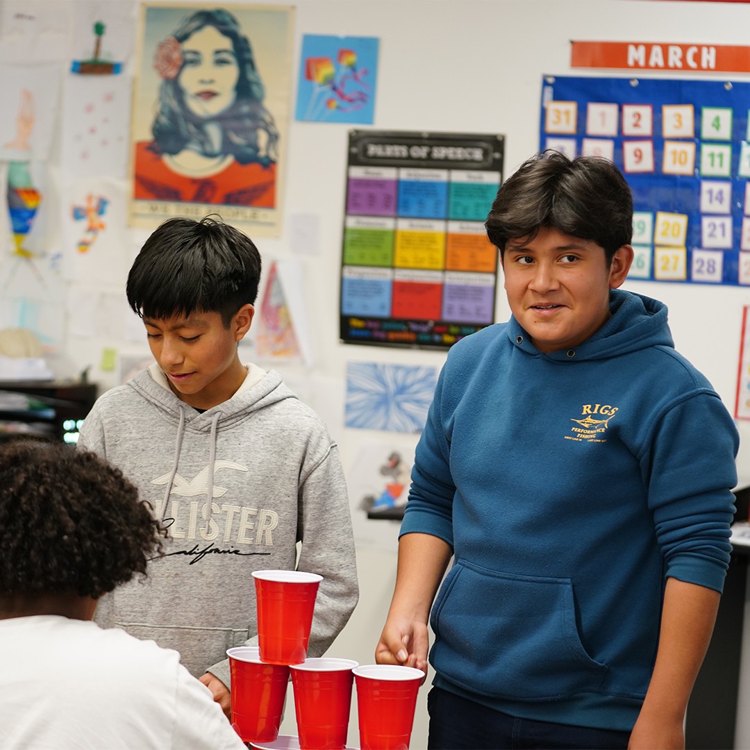 Students participating in hands-on Spanish learning games during after school program