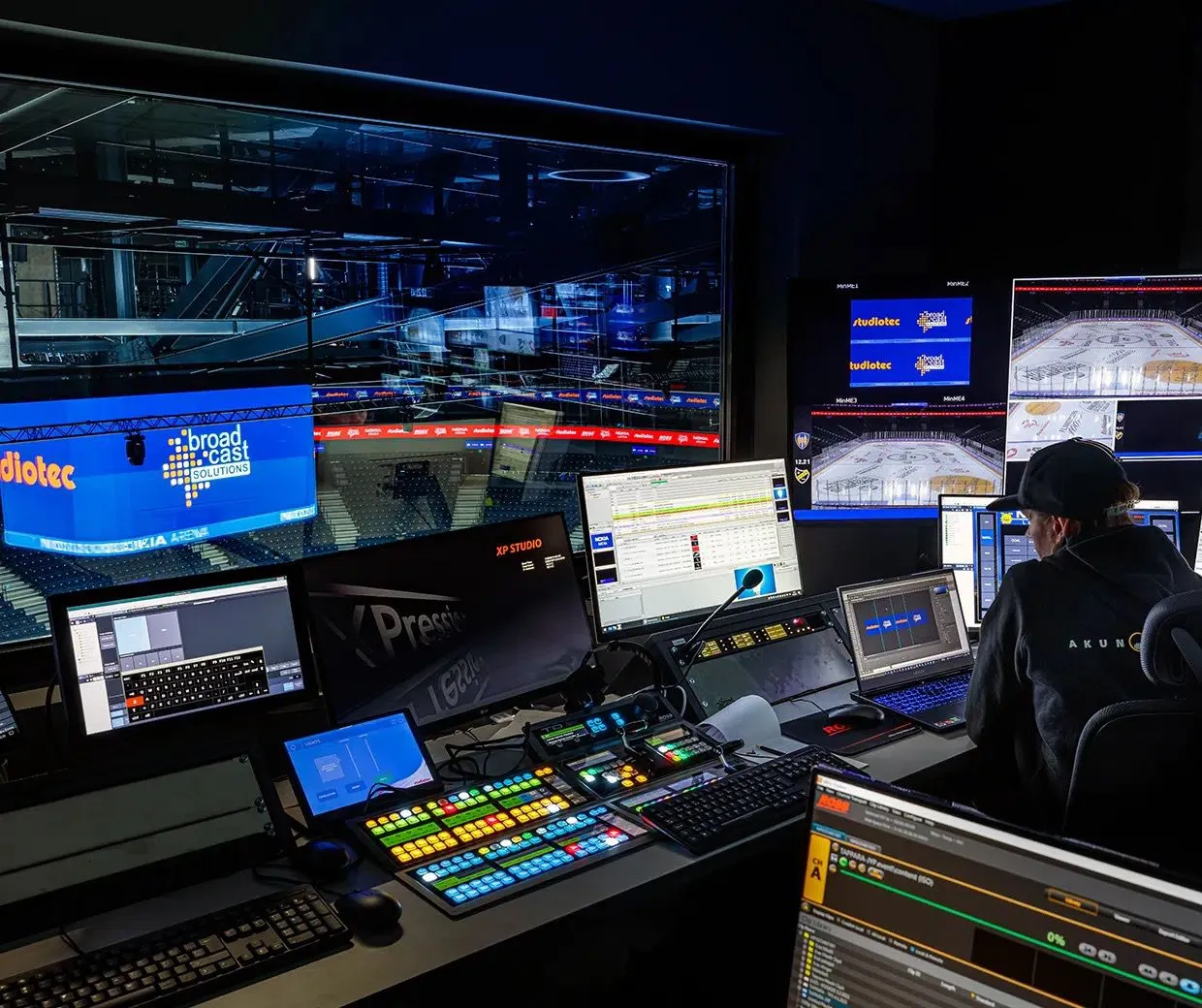 Live event control room managing broadcast, lighting, and venue operations for large-scale stadium event.