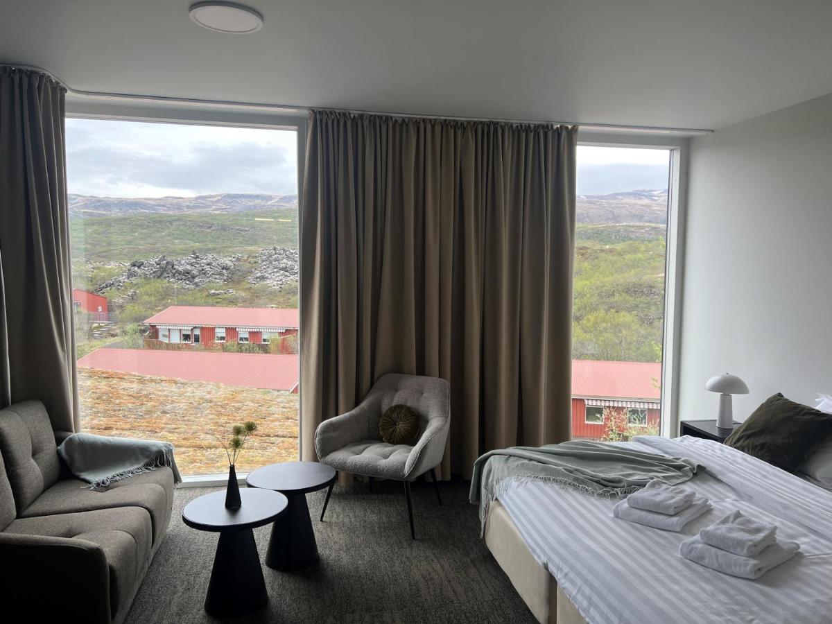 Triple Room at Hotel Bifröst – three single beds with soft lighting