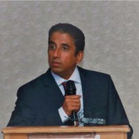 woman in white crew neck shirt smiling