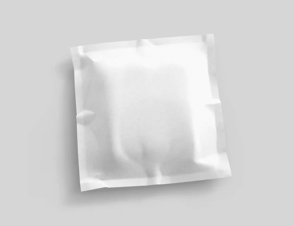 A black sealed pouch mockup with gold and white text, featuring a crinkled texture for a realistic look. The pouch is displayed against a light gray background, highlighting its 3D design.