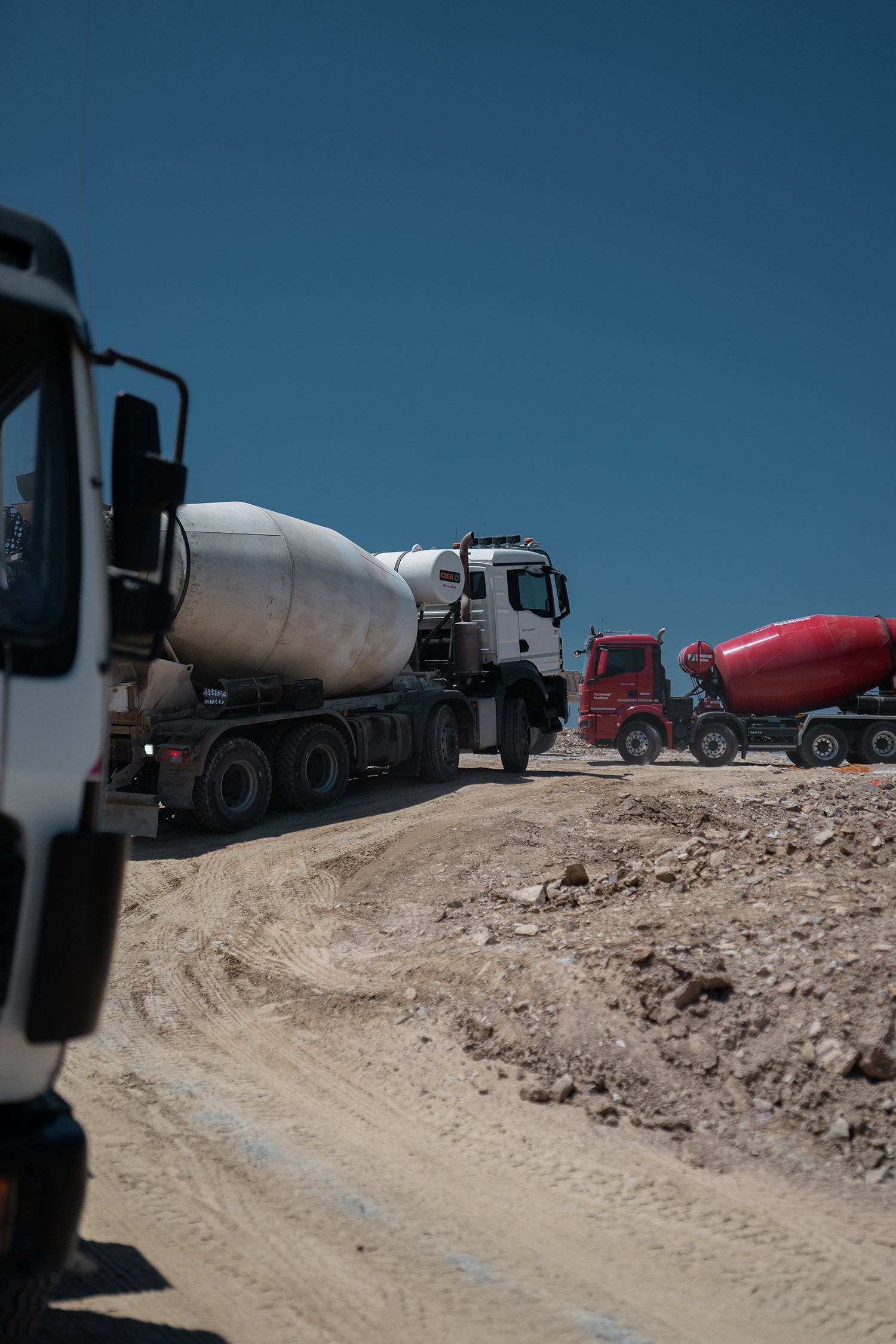 Concrete mixer trucks on a Magna Graecia construction site, photographed by TERAMOK