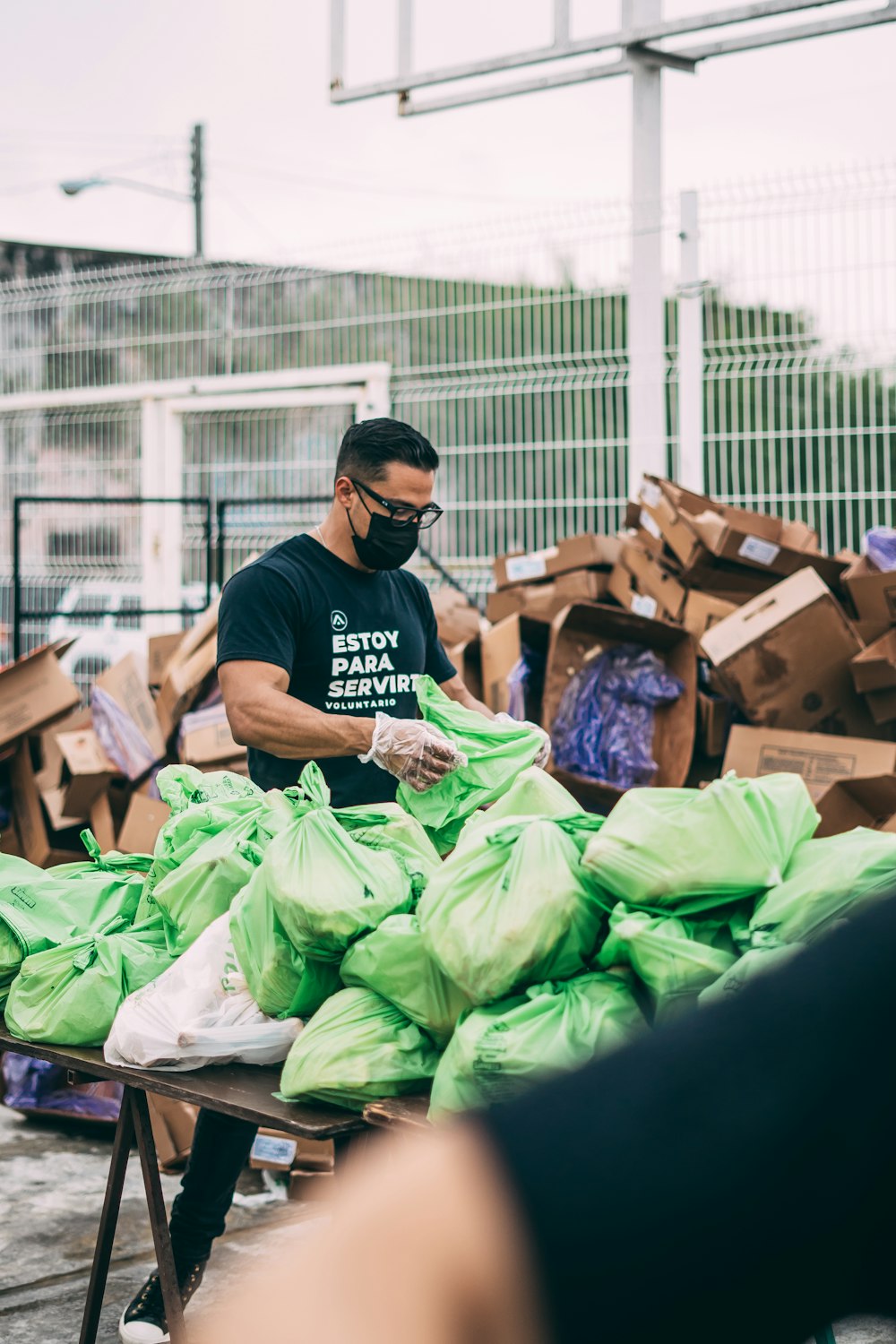 Volunteer handing out food parcels