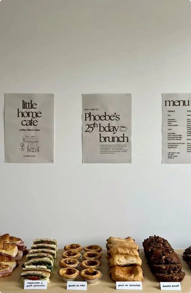 Cafe menu posters above pastries