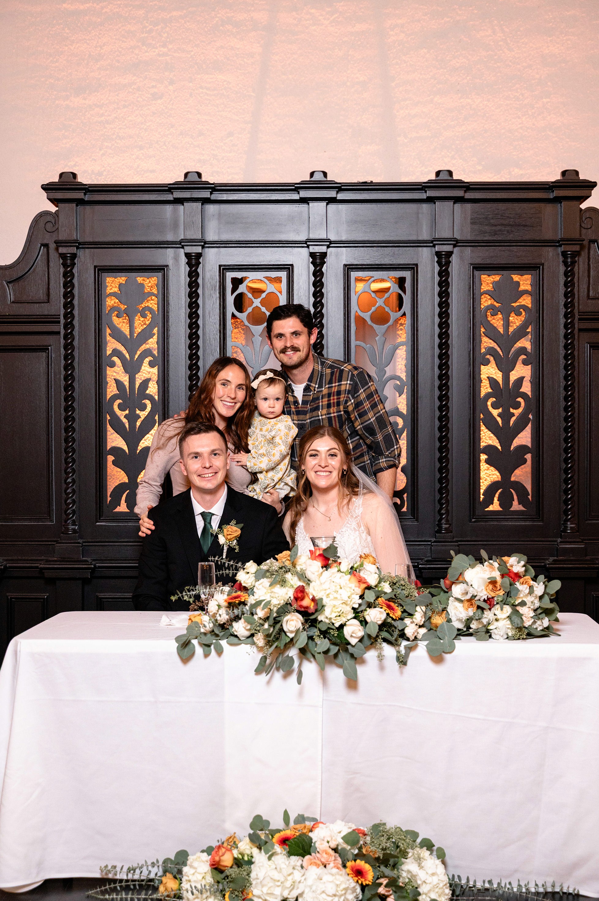 Flat lay wedding details with bouquet, rings, and sparkling bridal heels