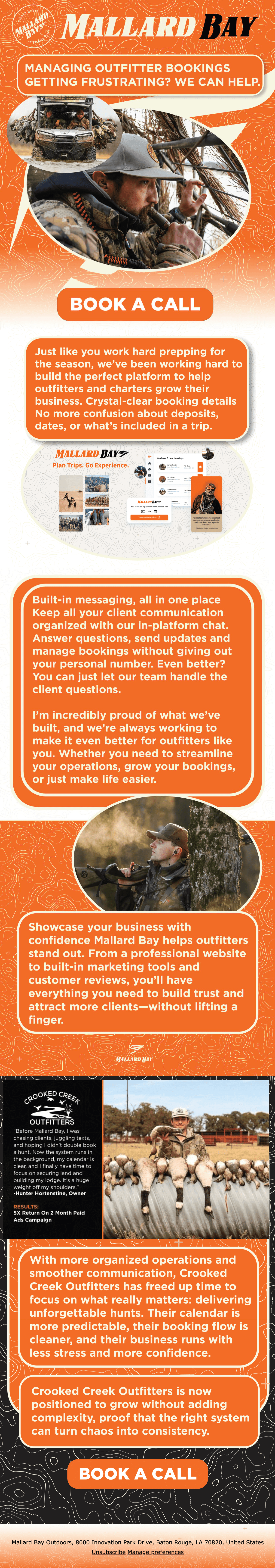 Black and white photo of two people looking at a computer screen with papers on wall