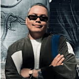 Woman in black hat on forest path.